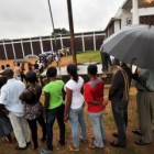Liberians line up to vote in the presidential, senatorial and legislative elections on October 11, 2011 at a polling station in Monrovia. Around 1.8 million Liberians were eligible to vote in the second election since the end of a 14-year civil war. The elections are seen as a litmus test of the west African nation's fragile democracy. (Issouf Sanogo /AFP/Getty Images)